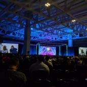 Wide angle view of Dries Buytaert on stage giving his keynote at DrupalCon Nashville 2018.